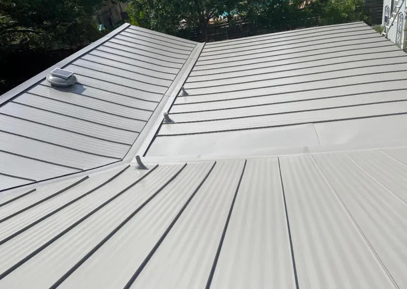 Solar attic fan installed on a metal roof for Roof Ventilation in Ponchatoula
